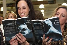 women reading 50 shades of grey